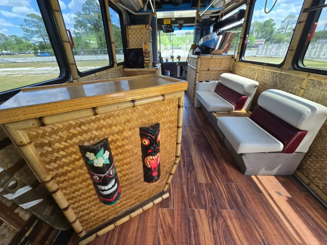 Tiki-themed bus interior with bamboo decor